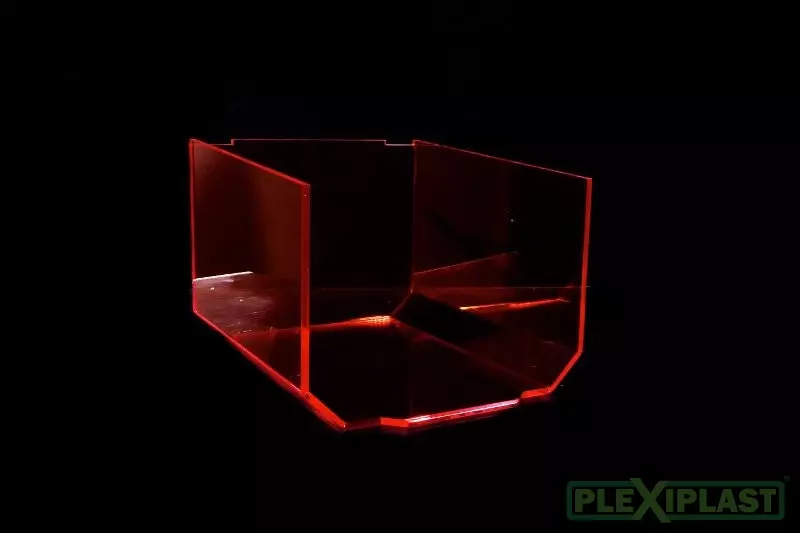 Colored shield made of transparent orange acrylic with several bends, bottom view