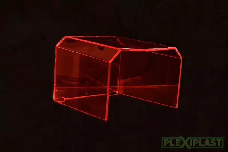 Colored shield made of transparent orange acrylic with several bends