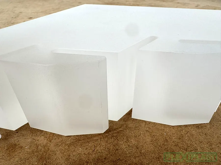 A plexiglass block with a sandblasted finish